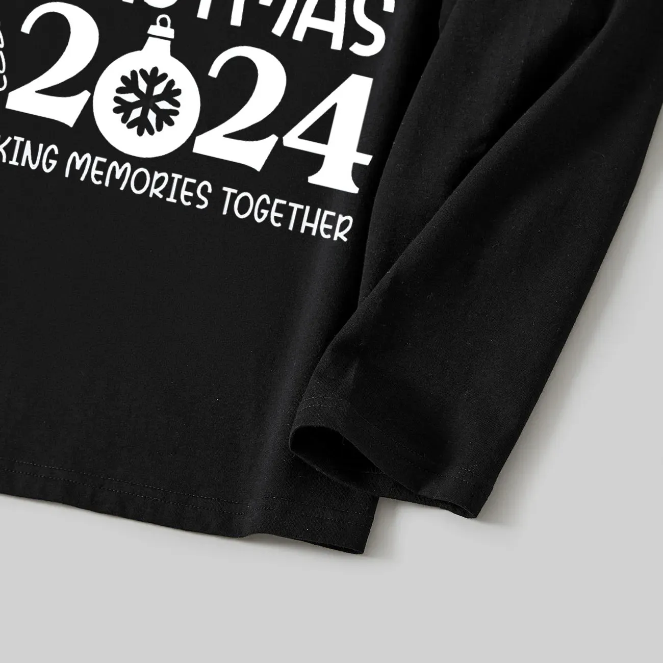 "Family Christmas 2024 Making Memories Together" Text and Santa Hat Printed Black and Green Plaid Family Christmas Matching Pajamas